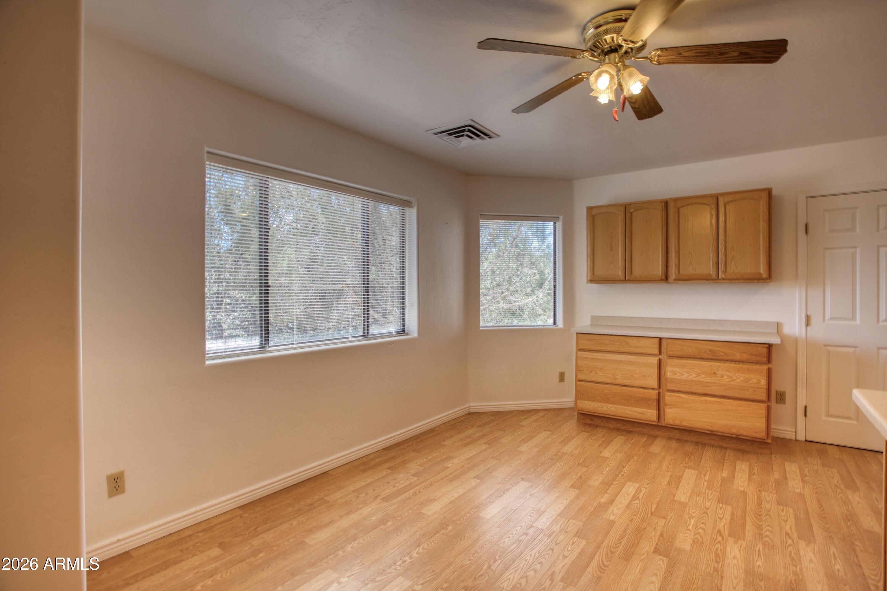 949 Geronimo Lane Show Low, AZ 85901 - Photo 14 of 43 a view of room window and wooden floor