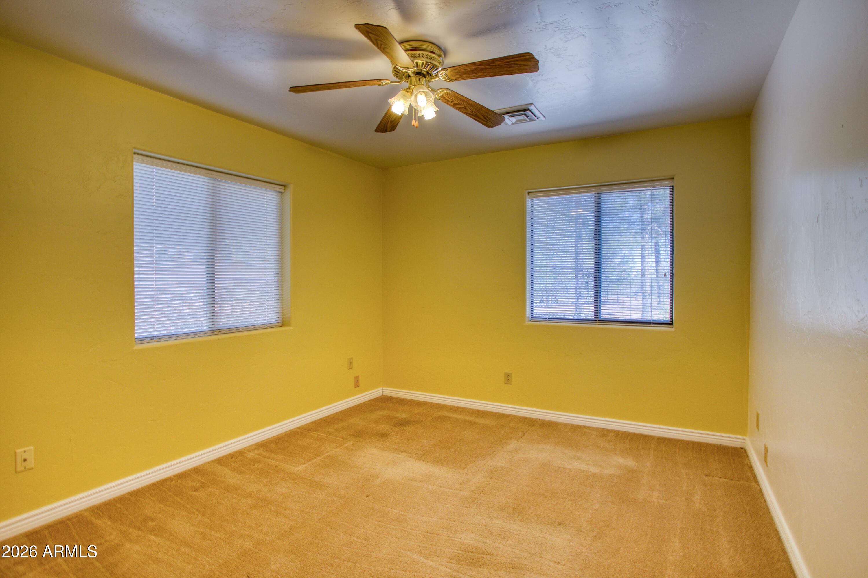 949 Geronimo Lane Show Low, AZ 85901 - Photo 21 of 43 a view of a yellow room