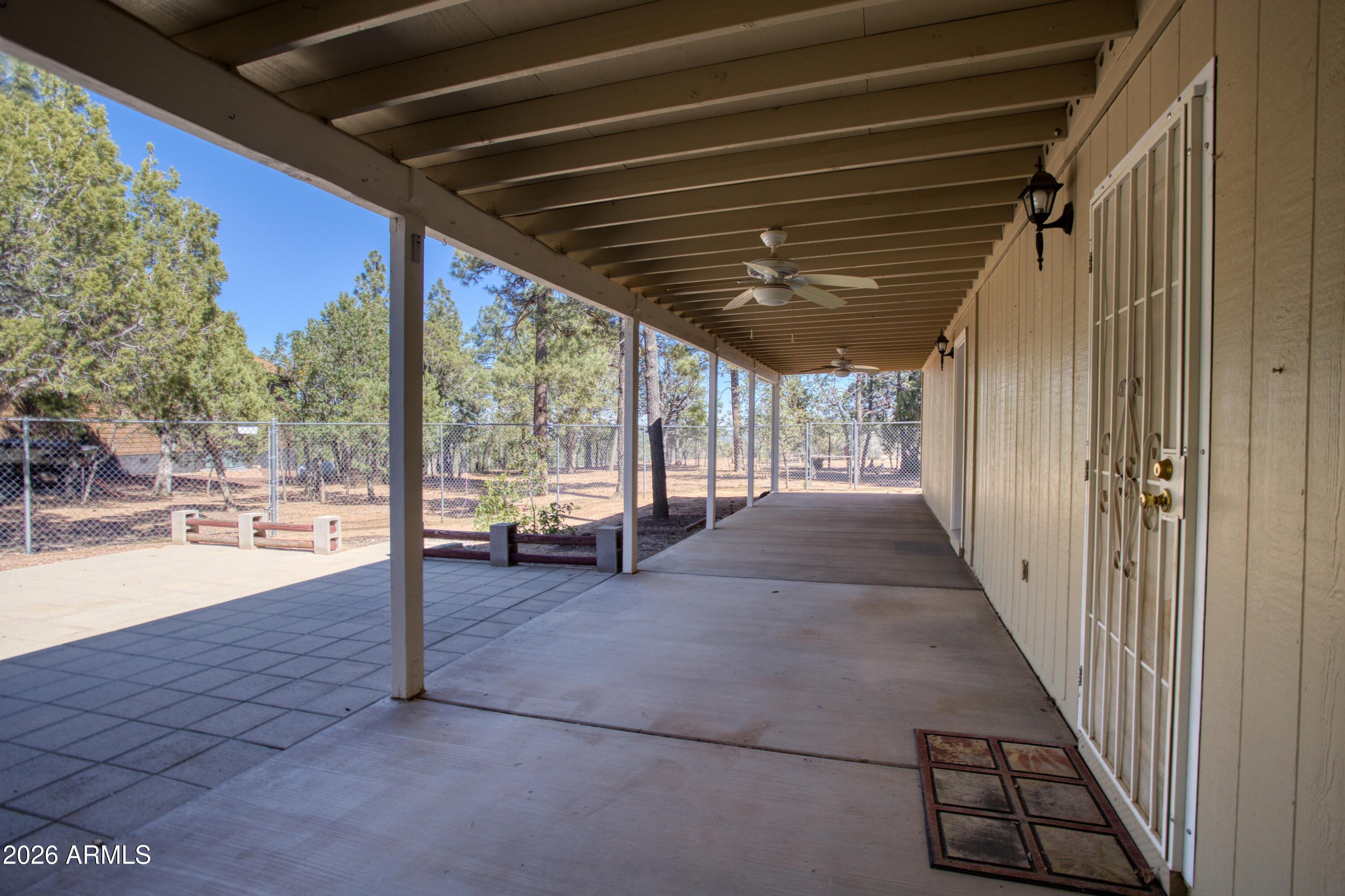 949 Geronimo Lane Show Low, AZ 85901 - Photo 30 of 43 a view of a porch with wooden floor and stairs