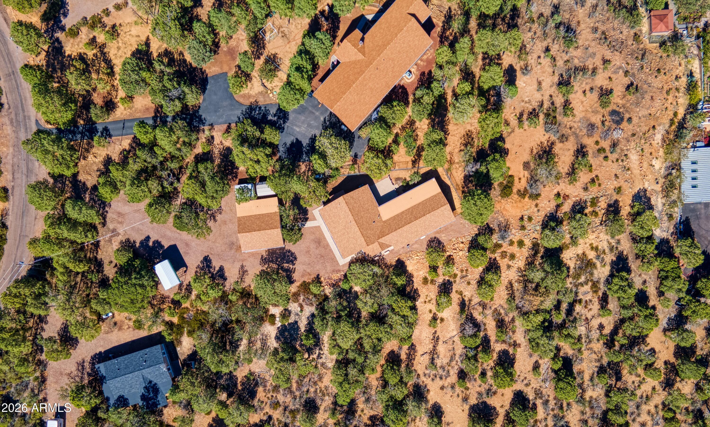949 Geronimo Lane Show Low, AZ 85901 - Photo 39 of 43 an aerial view of a house with a yard and trees