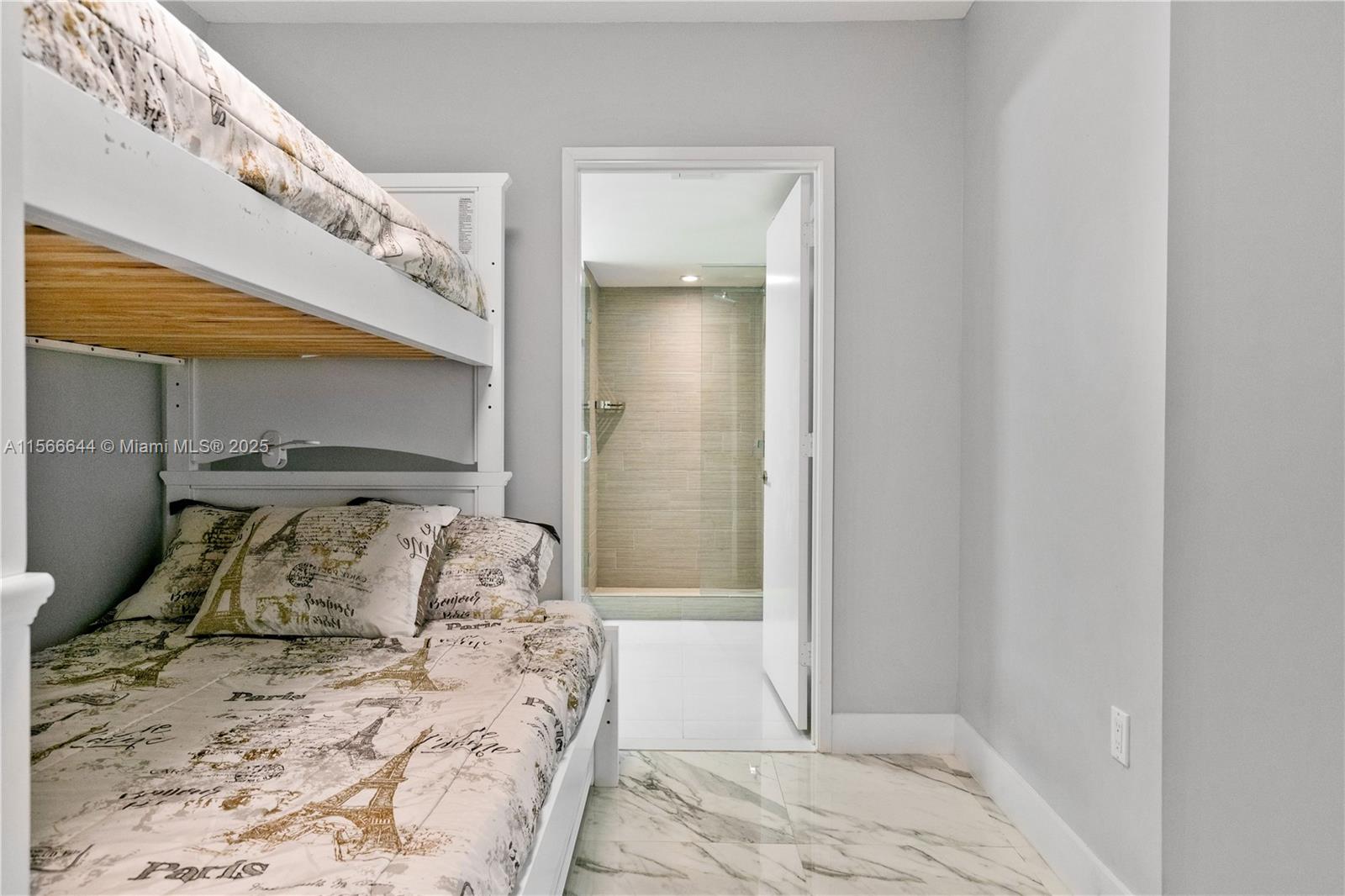 330 Sunny Isles Boulevard, Unit 51103 Sunny Isles Beach, FL 33160 - Photo 14 of 34 a bedroom with a bed and a window