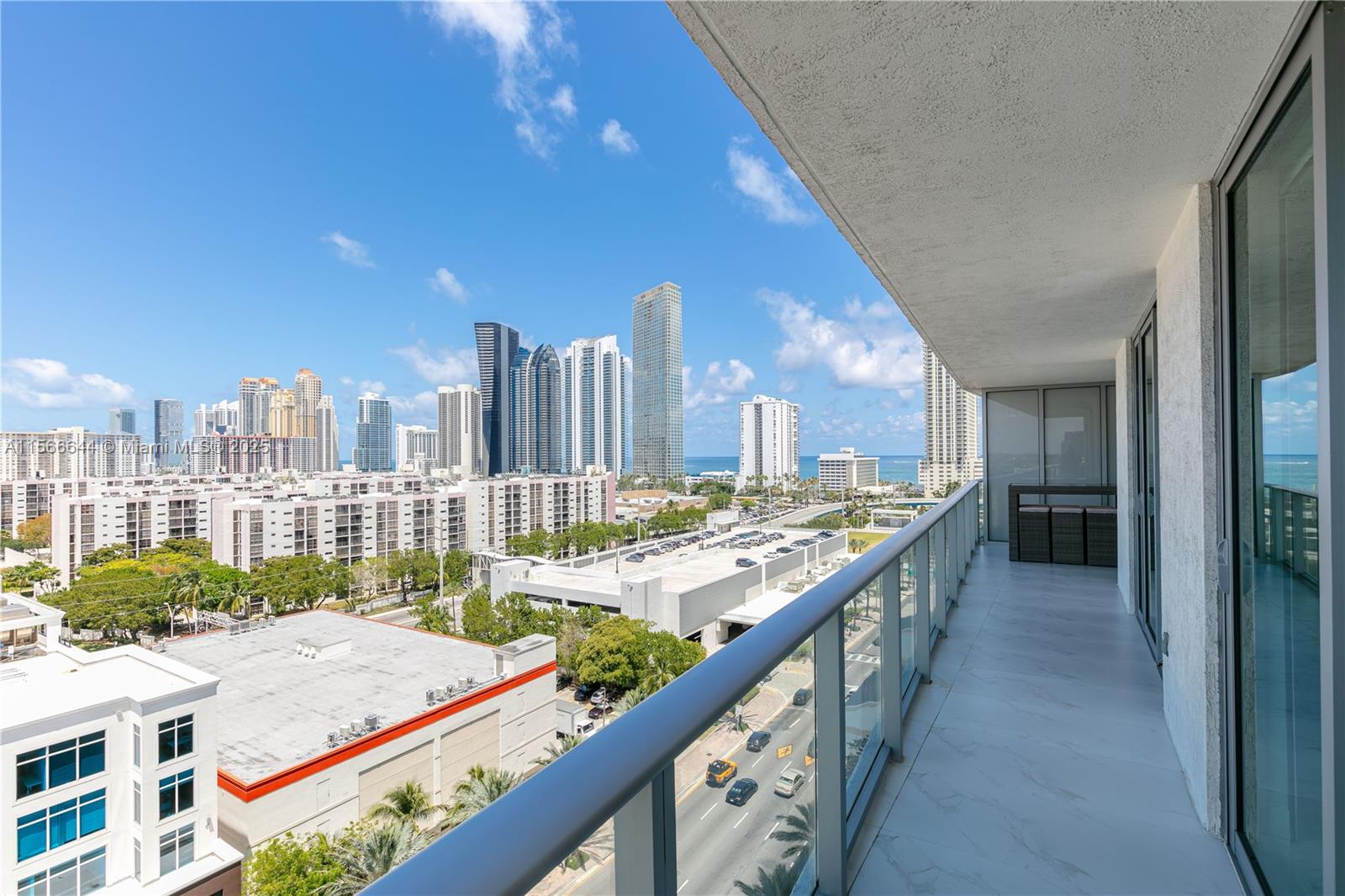 330 Sunny Isles Boulevard, Unit 51103 Sunny Isles Beach, FL 33160 - Photo 26 of 34 a city view with tall buildings