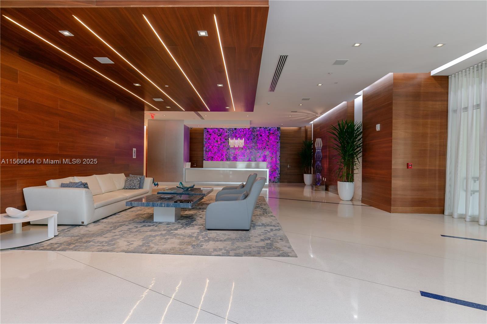 330 Sunny Isles Boulevard, Unit 51103 Sunny Isles Beach, FL 33160 - Photo 33 of 34 a living room with furniture and a projector