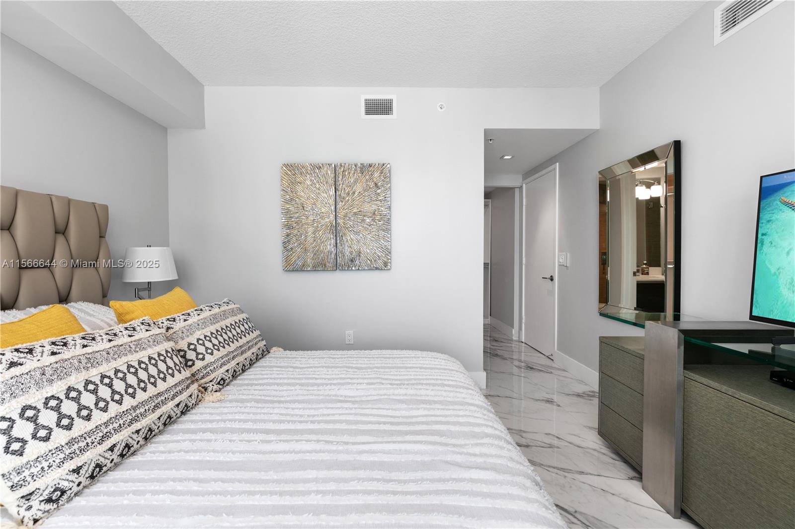 330 Sunny Isles Boulevard, Unit 51103 Sunny Isles Beach, FL 33160 - Photo 9 of 34 a bedroom with a bed and a view of bedroom