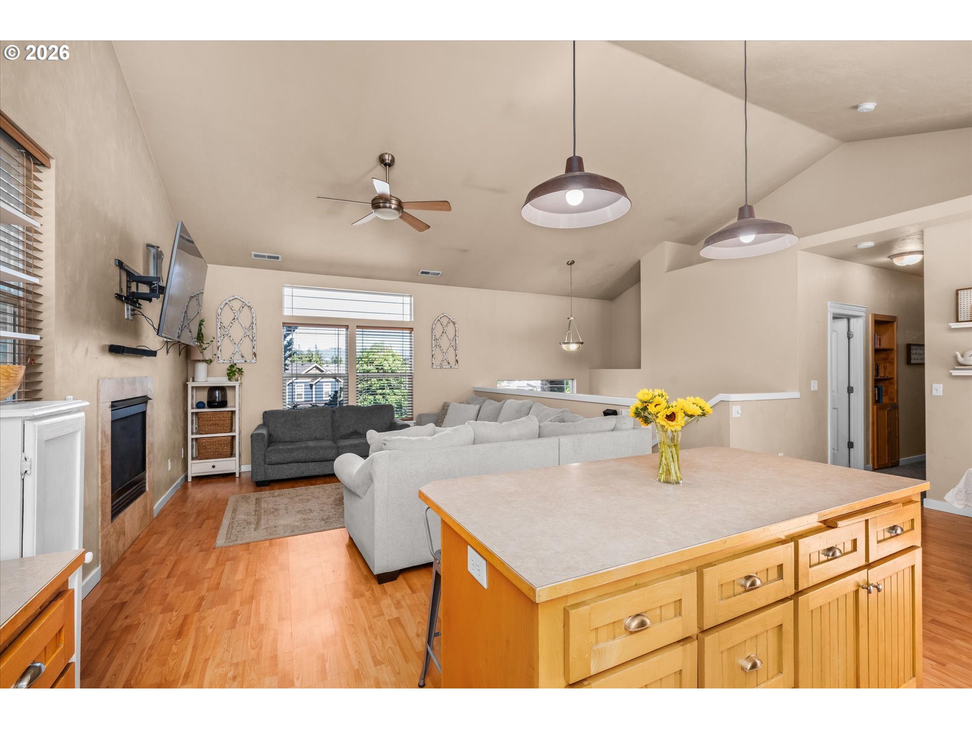 277 South 67th Court Springfield, OR 97478 - Photo 12 of 44 a kitchen with a sink a microwave a dining table and chairs