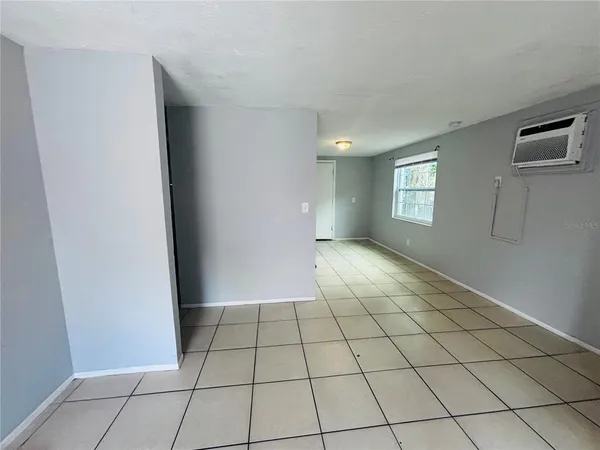 a view of an empty room and window