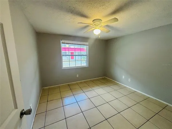 a view of an empty room and window