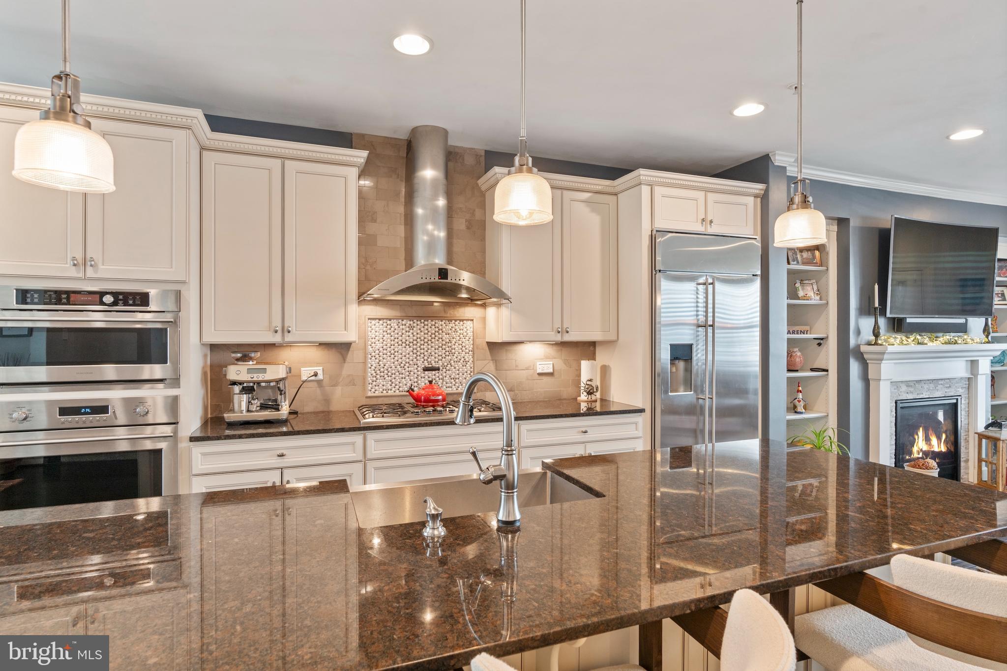 1311 Belt Street Baltimore, MD 21230 - Photo 11 of 65 a kitchen with stainless steel appliances a refrigerator a sink a stove and cabinets