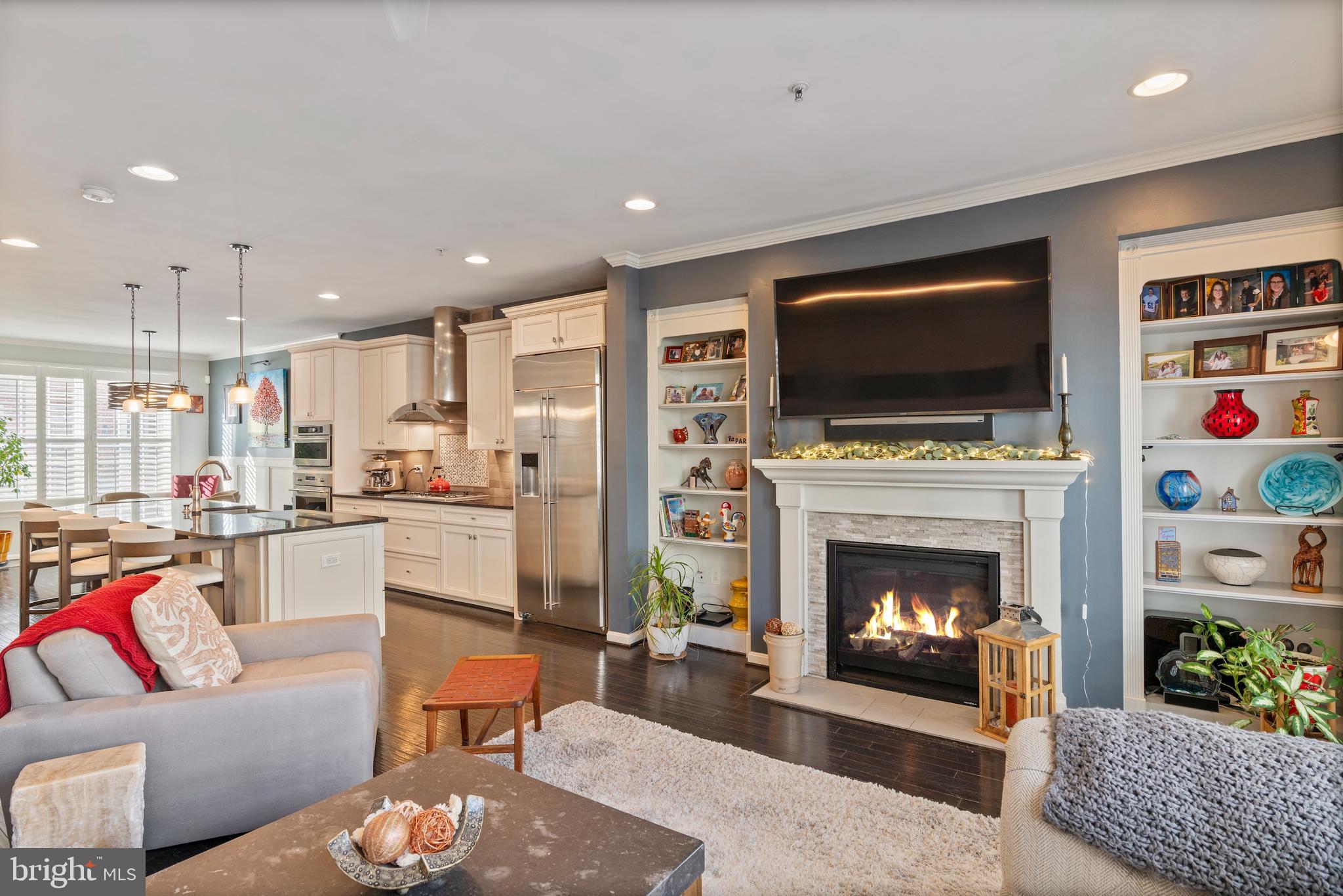 1311 Belt Street Baltimore, MD 21230 - Photo 13 of 65 a living room with furniture a flat screen tv and a fireplace