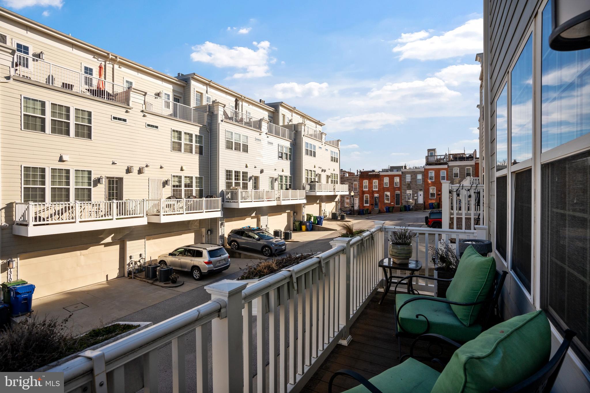 1311 Belt Street Baltimore, MD 21230 - Photo 16 of 65 a view of balcony with couch and wooden floor
