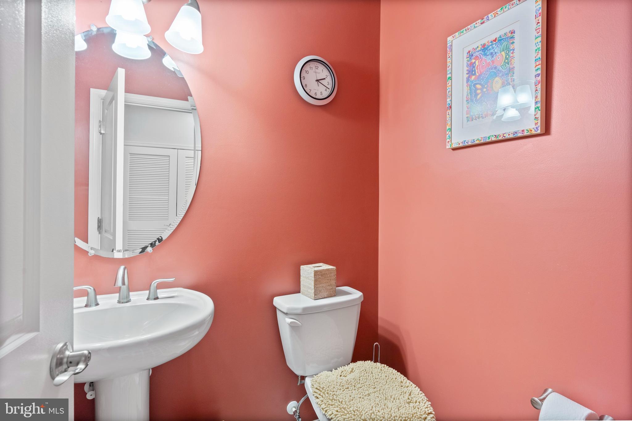 1311 Belt Street Baltimore, MD 21230 - Photo 20 of 65 a bathroom with a toilet a sink and mirror
