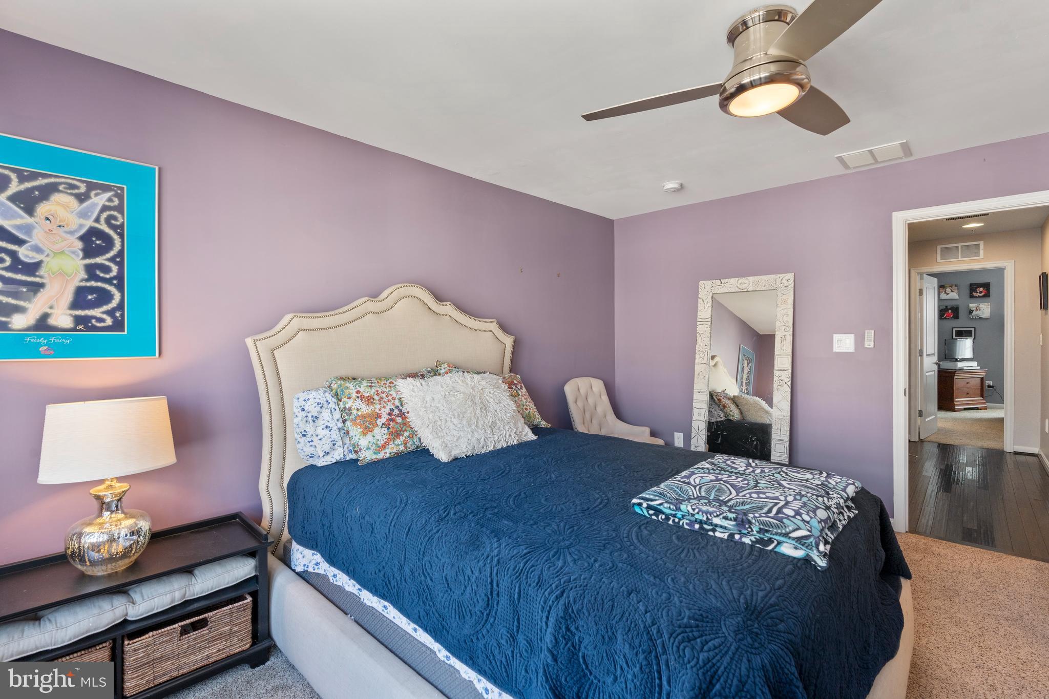 1311 Belt Street Baltimore, MD 21230 - Photo 27 of 65 a bedroom with a bed and a lamp on dresser