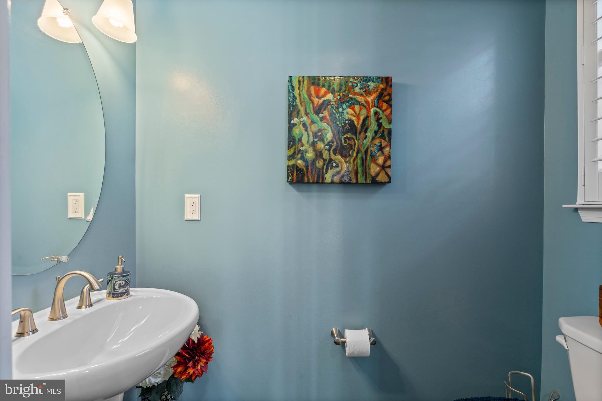 1311 Belt Street Baltimore, MD 21230 - Photo 31 of 65 a bathroom with a sink mirror and toilet