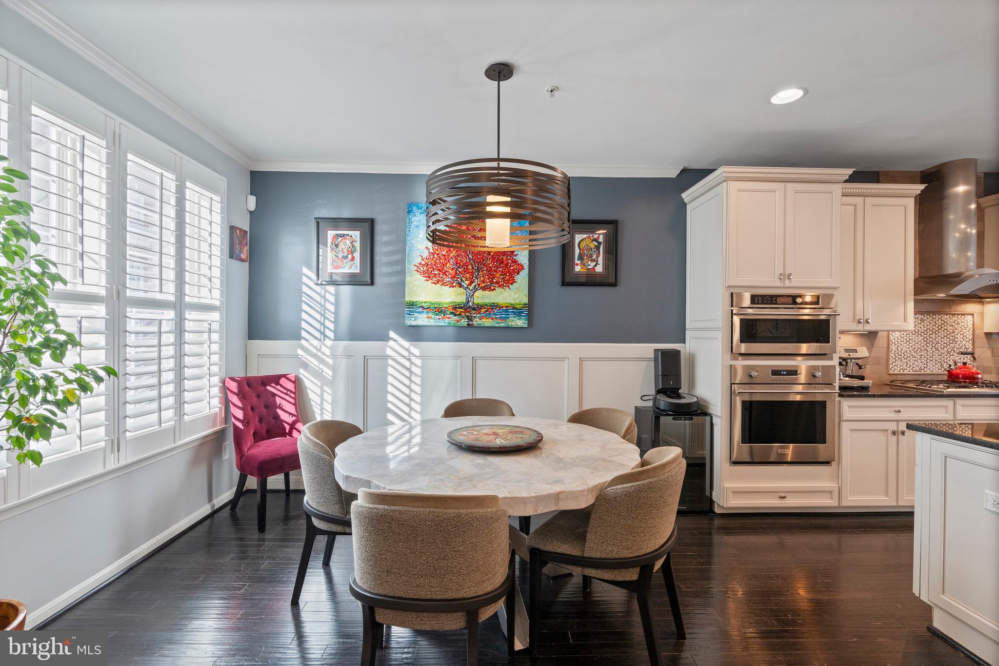 1311 Belt Street Baltimore, MD 21230 - Photo 33 of 65 a kitchen with stainless steel appliances a dining table chairs and granite counter tops