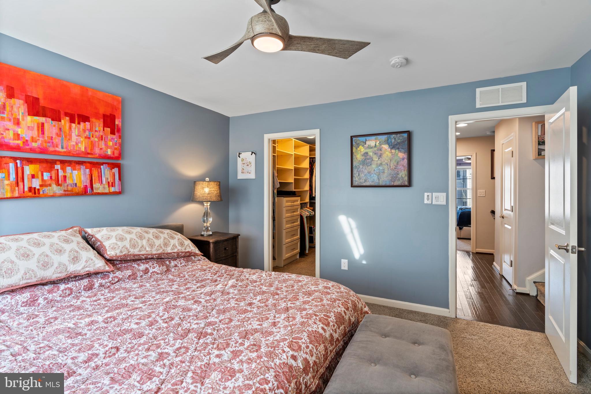 1311 Belt Street Baltimore, MD 21230 - Photo 42 of 65 a bedroom with a large bed and a chandelier