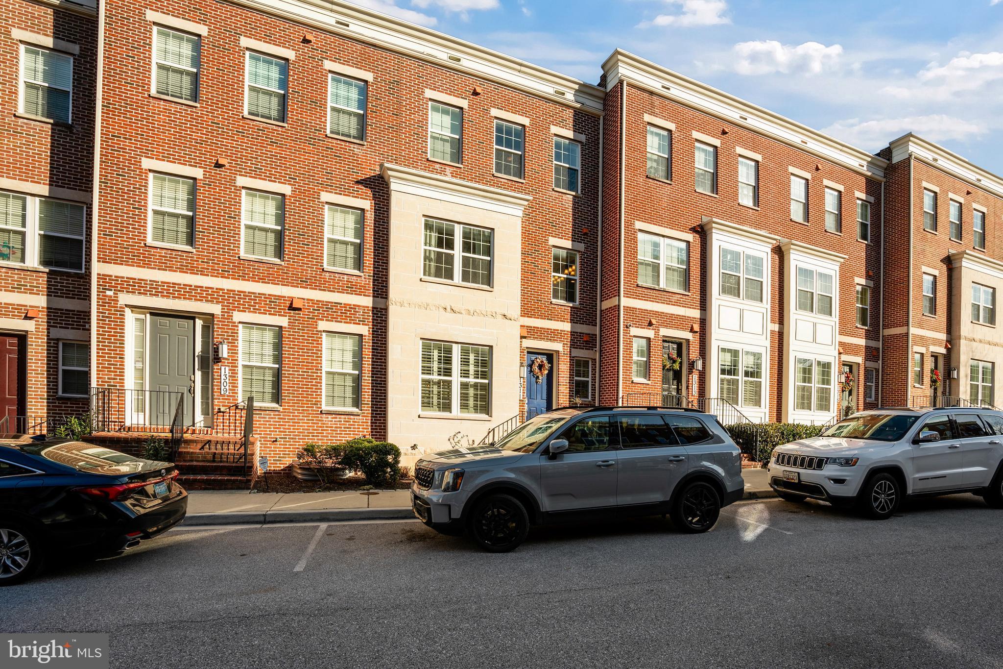 1311 Belt Street Baltimore, MD 21230 - Photo 61 of 65 a car parked in front of a brick building