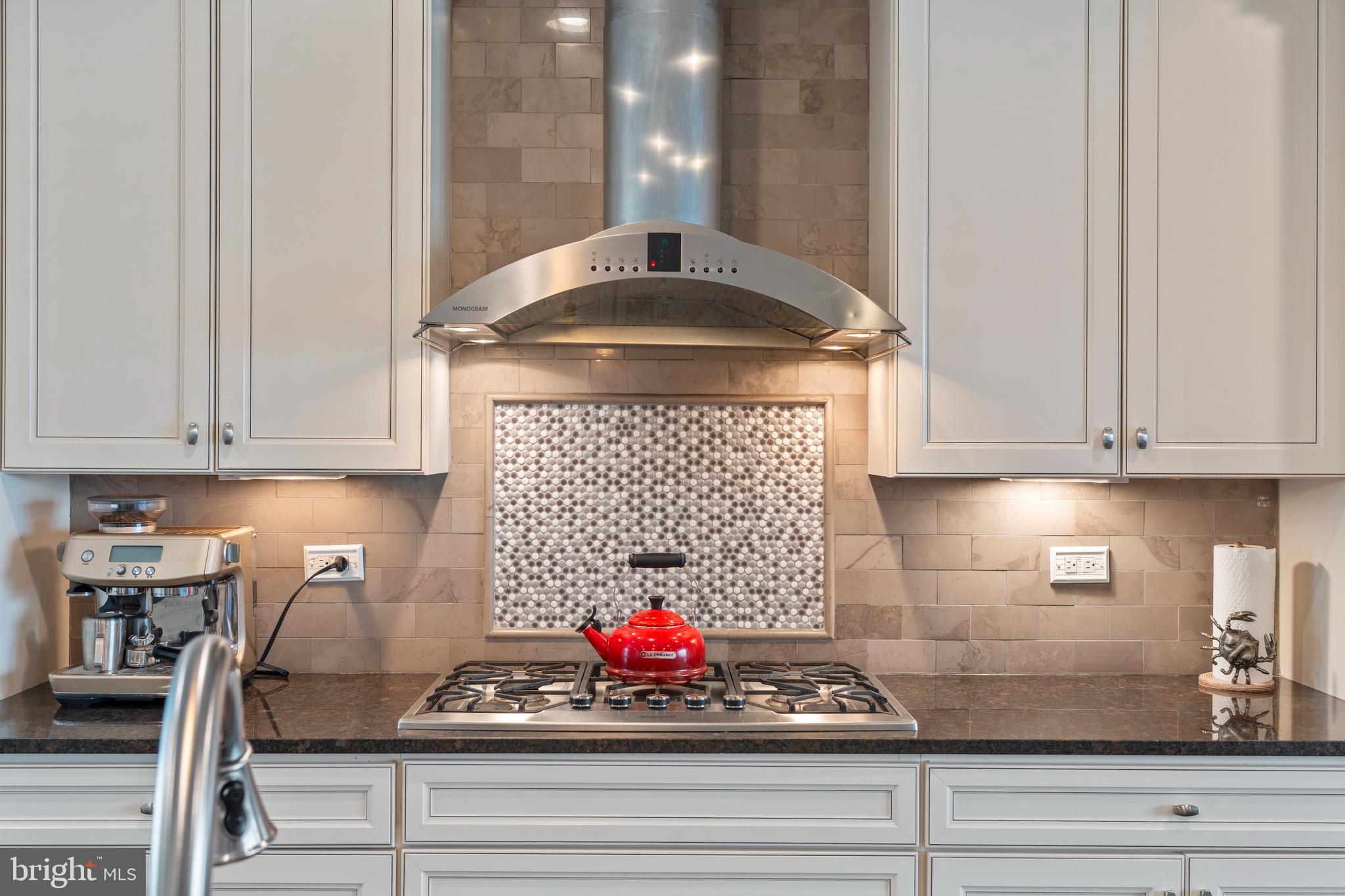 1311 Belt Street Baltimore, MD 21230 - Photo 10 of 65 a kitchen with an oven a cabinets and a stove