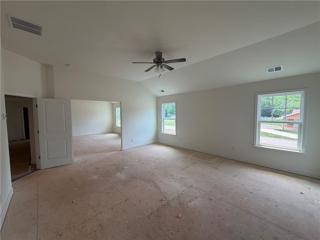 41 Woodland Road Covington, GA 30016 - Photo 8 of 46 a view of a livingroom with a ceiling fan and window