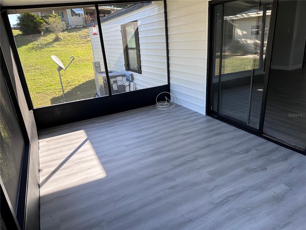 3458 North Citrus Circle, Unit 1803 Zellwood, FL 32798 - Photo 17 of 20 a view of front door with wooden floor