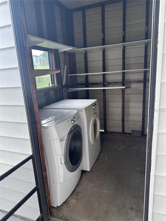 3458 North Citrus Circle, Unit 1803 Zellwood, FL 32798 - Photo 18 of 20 a utility room with dryer and washer