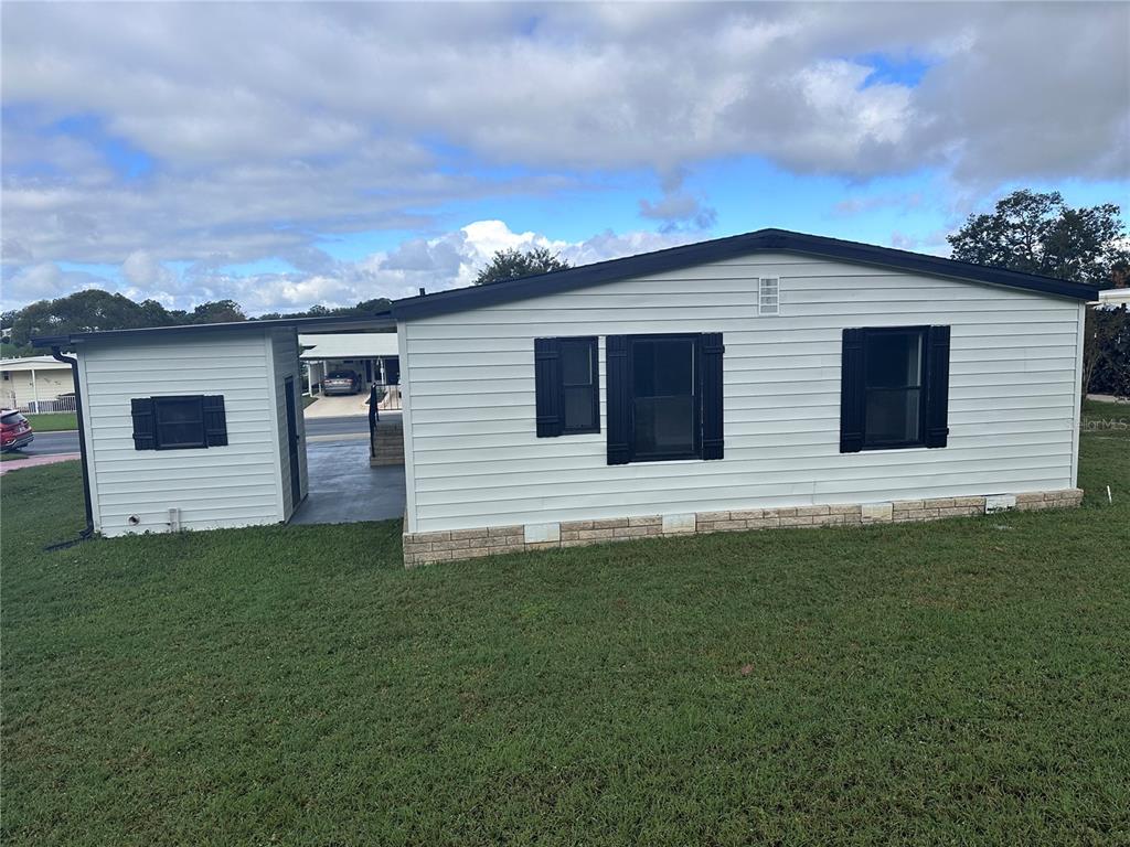 3458 North Citrus Circle, Unit 1803 Zellwood, FL 32798 - Photo 20 of 20 a backyard of a house with lots of green space