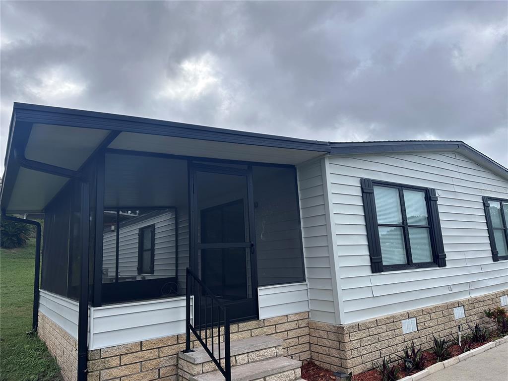 3458 North Citrus Circle, Unit 1803 Zellwood, FL 32798 - Photo 2 of 20 front view of a house with a window