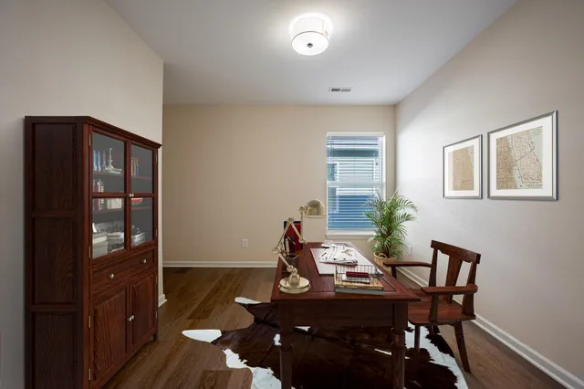 a dining room with furniture and window
