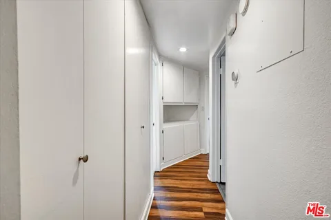 a view of a hallway with stairs