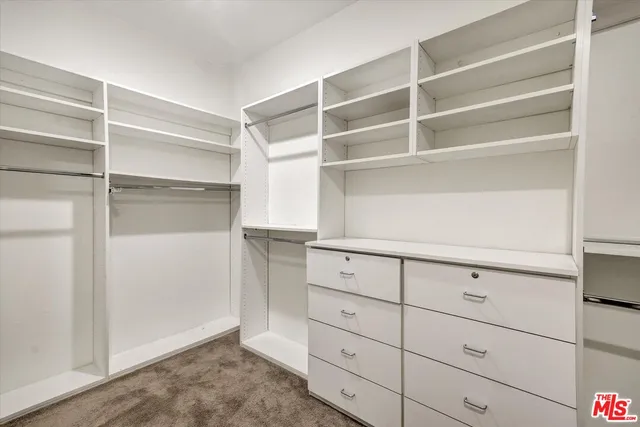 a view of an empty walk in closet