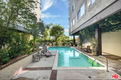 a view of a swimming pool with a patio