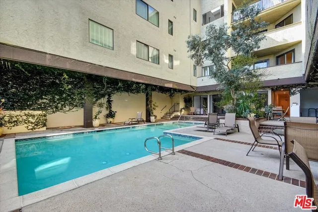 a view of a building with sitting area