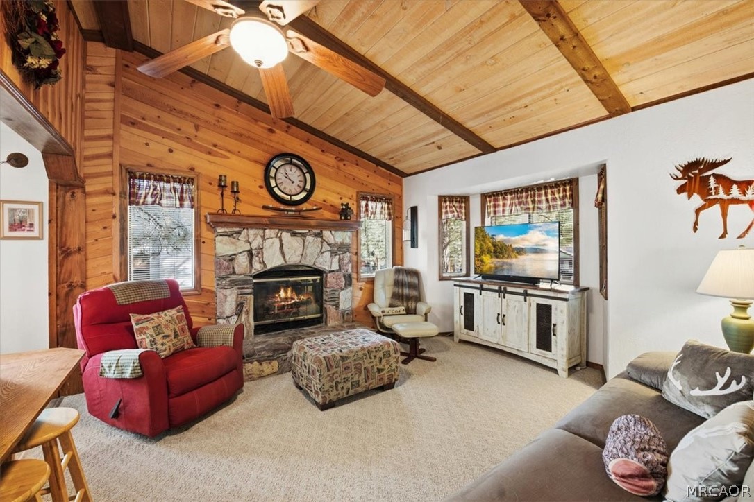 358 Victoria Lane Sugarloaf, CA 92386 - Photo 11 of 38 a living room with furniture a flat screen tv and a fireplace