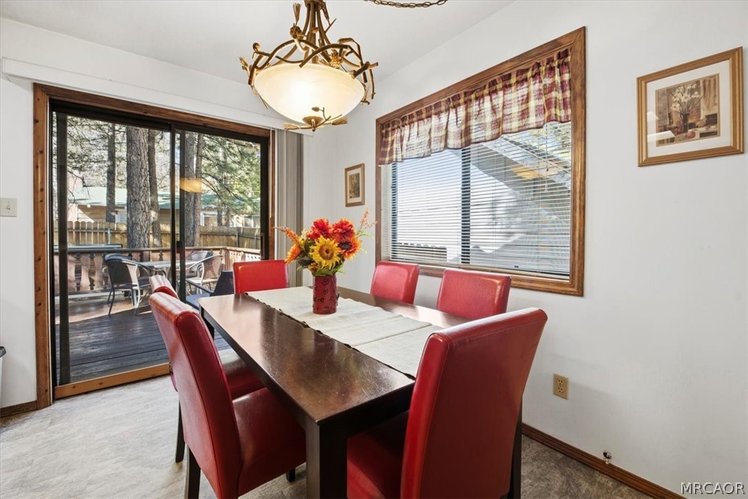 358 Victoria Lane Sugarloaf, CA 92386 - Photo 15 of 38 a view of a dining room with furniture window and outside view
