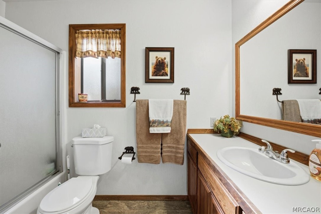 358 Victoria Lane Sugarloaf, CA 92386 - Photo 27 of 38 a bathroom with a sink toilet and mirror