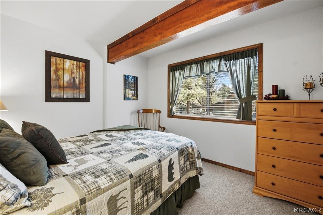 358 Victoria Lane Sugarloaf, CA 92386 - Photo 28 of 38 a bedroom with a bed and a window