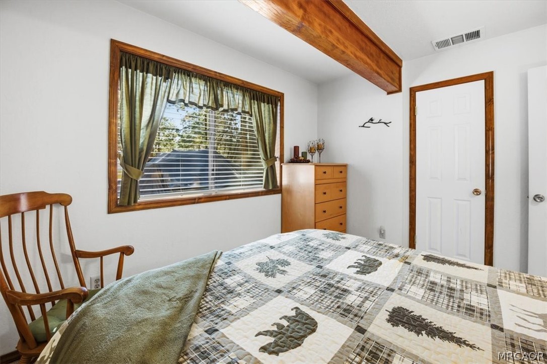358 Victoria Lane Sugarloaf, CA 92386 - Photo 30 of 38 a bedroom with a bed and a window