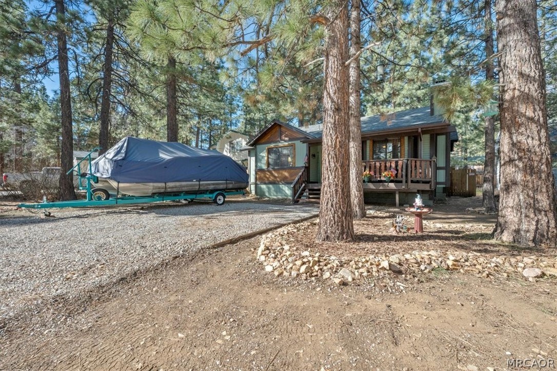 358 Victoria Lane Sugarloaf, CA 92386 - Photo 4 of 38 a view of a house with a yard and large tree
