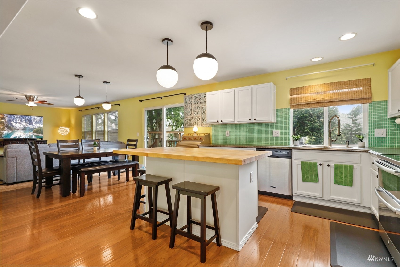 18808 1st Place West Bothell, WA 98012 - Photo 13 of 40 a kitchen with a table chairs and wooden floor