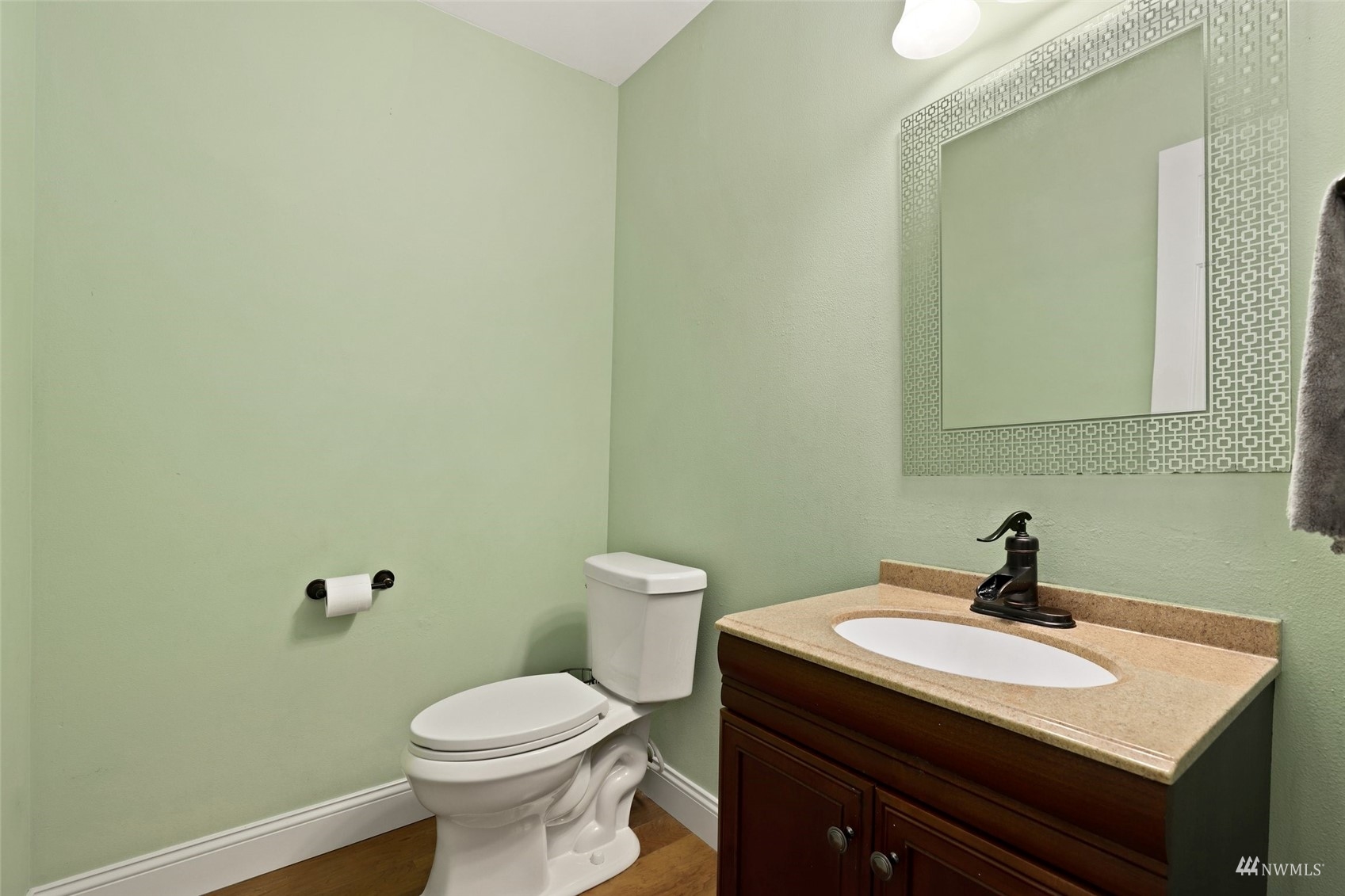 18808 1st Place West Bothell, WA 98012 - Photo 14 of 40 a bathroom with a sink a toilet and mirror