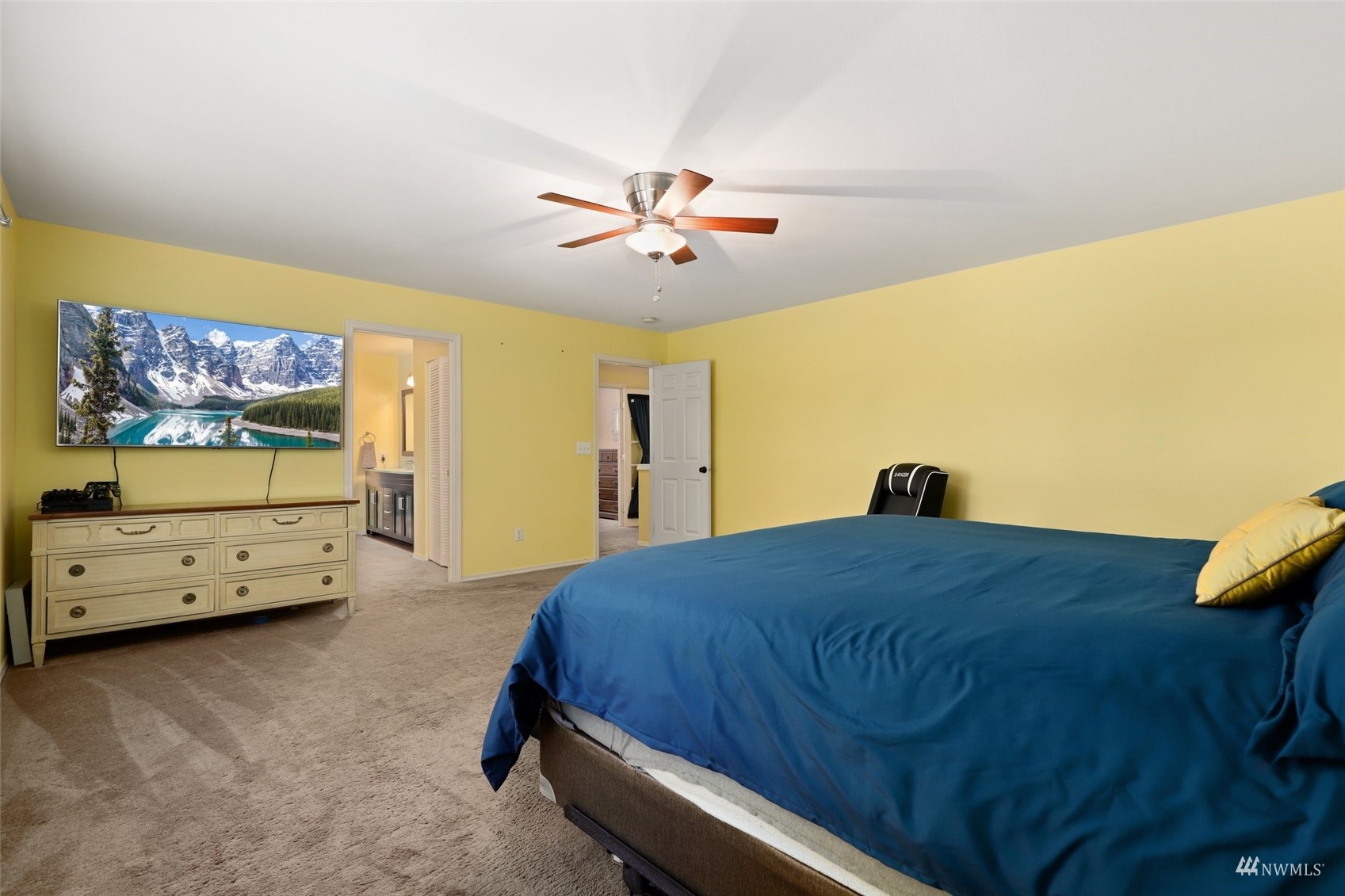 18808 1st Place West Bothell, WA 98012 - Photo 21 of 40 a bedroom with a bed and a chandelier