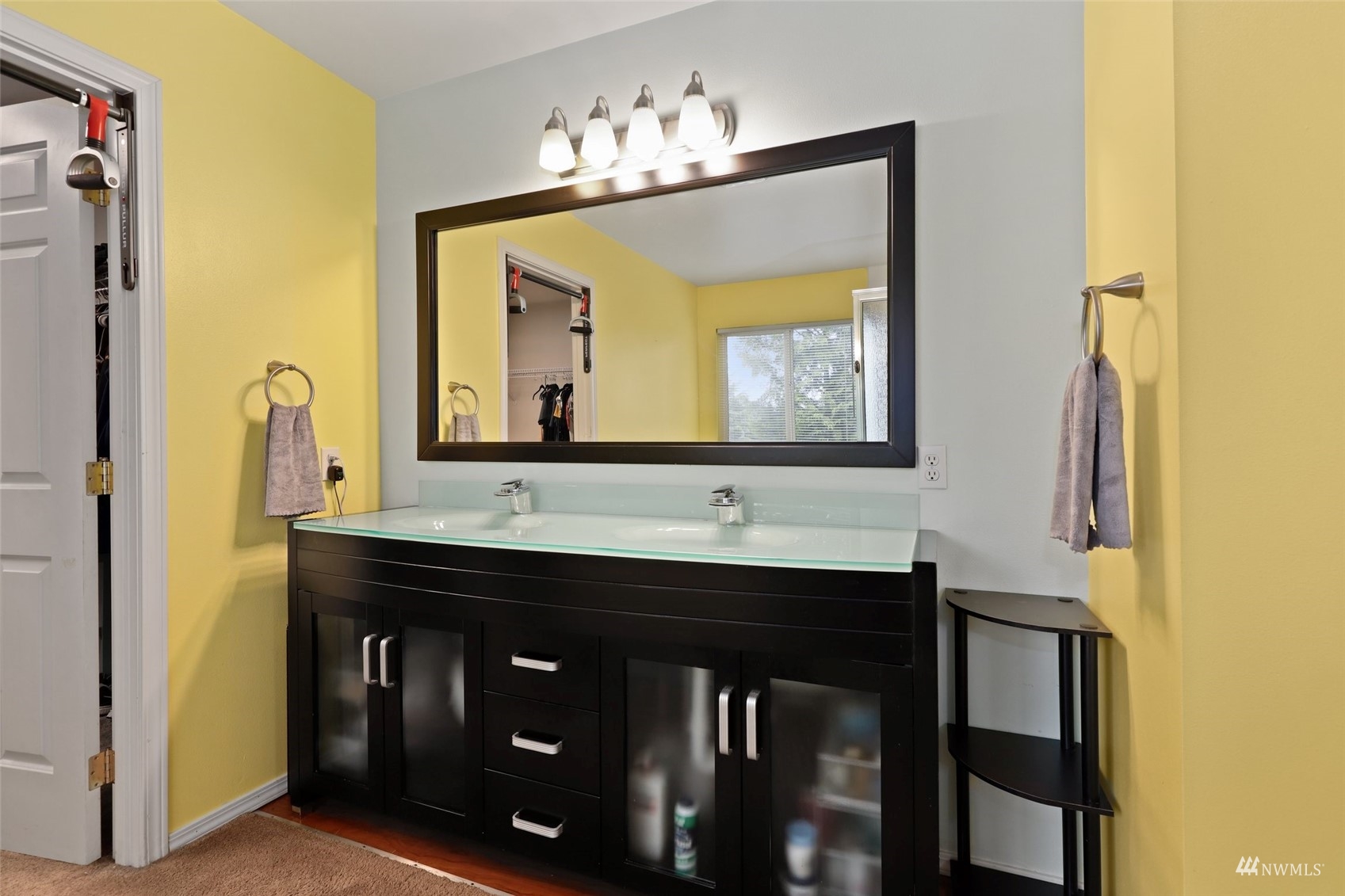 18808 1st Place West Bothell, WA 98012 - Photo 24 of 40 a bathroom with a sink and a mirror