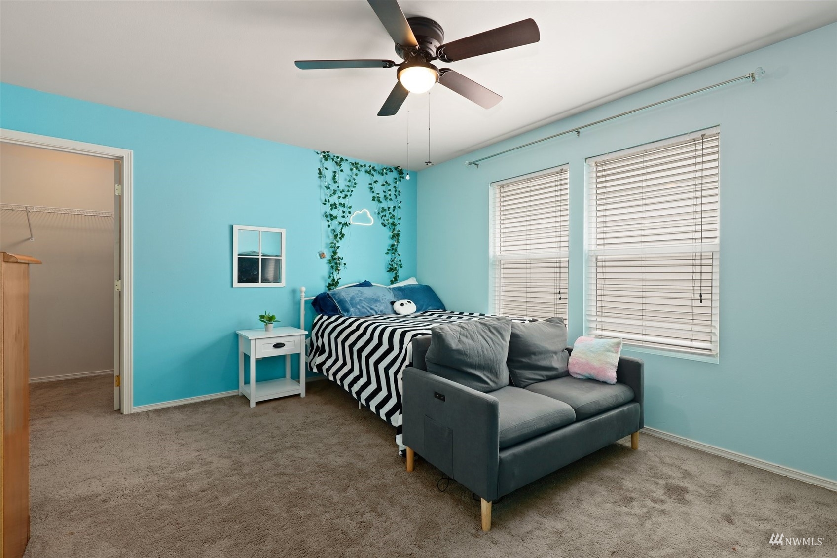 18808 1st Place West Bothell, WA 98012 - Photo 26 of 40 a bedroom with a bed and a chandelier