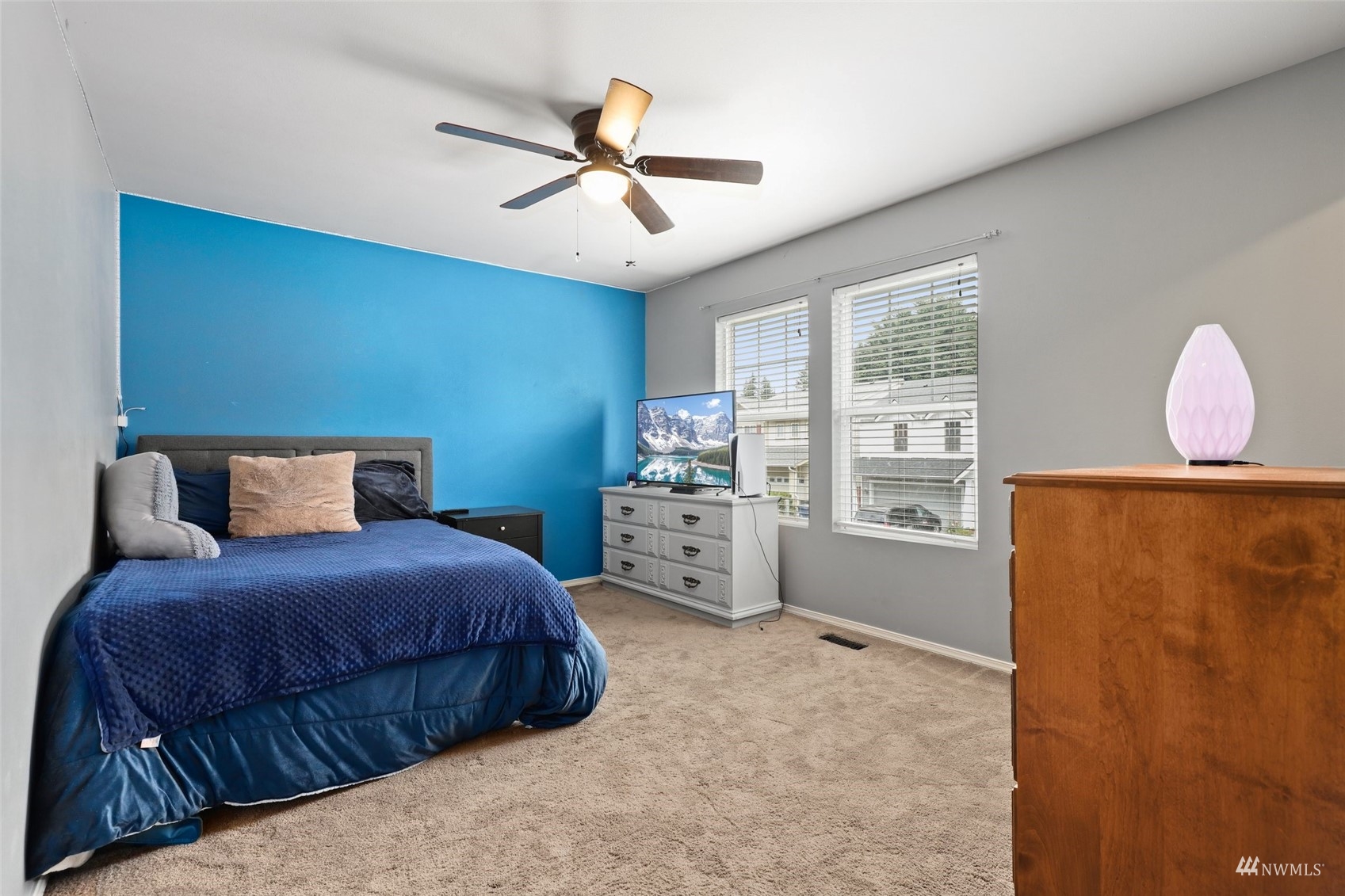 18808 1st Place West Bothell, WA 98012 - Photo 28 of 40 a bedroom with a bed a dresser and windows