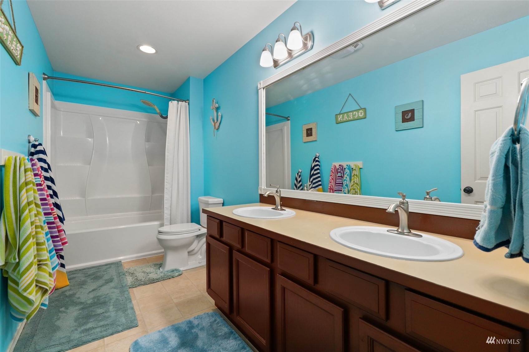 18808 1st Place West Bothell, WA 98012 - Photo 29 of 40 a bathroom with a sink double vanity and a mirror