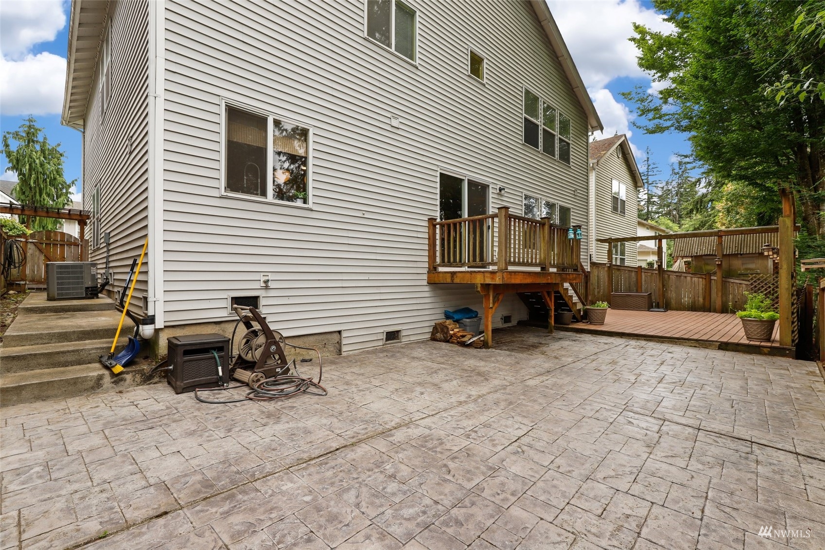 18808 1st Place West Bothell, WA 98012 - Photo 31 of 40 a view of a house with a patio and a yard