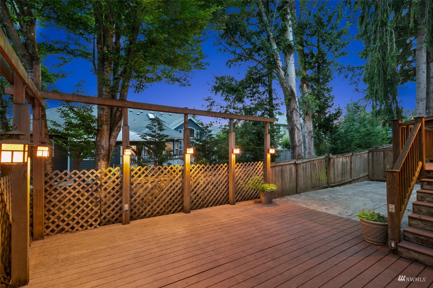 18808 1st Place West Bothell, WA 98012 - Photo 35 of 40 a view of a deck with a floor to ceiling window with wooden fence