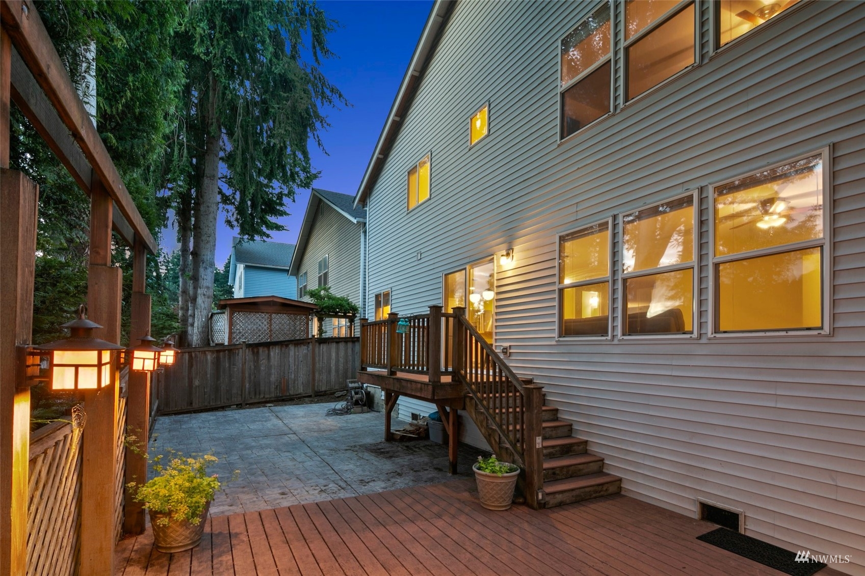 18808 1st Place West Bothell, WA 98012 - Photo 36 of 40 a view of a deck with chairs and wooden fence