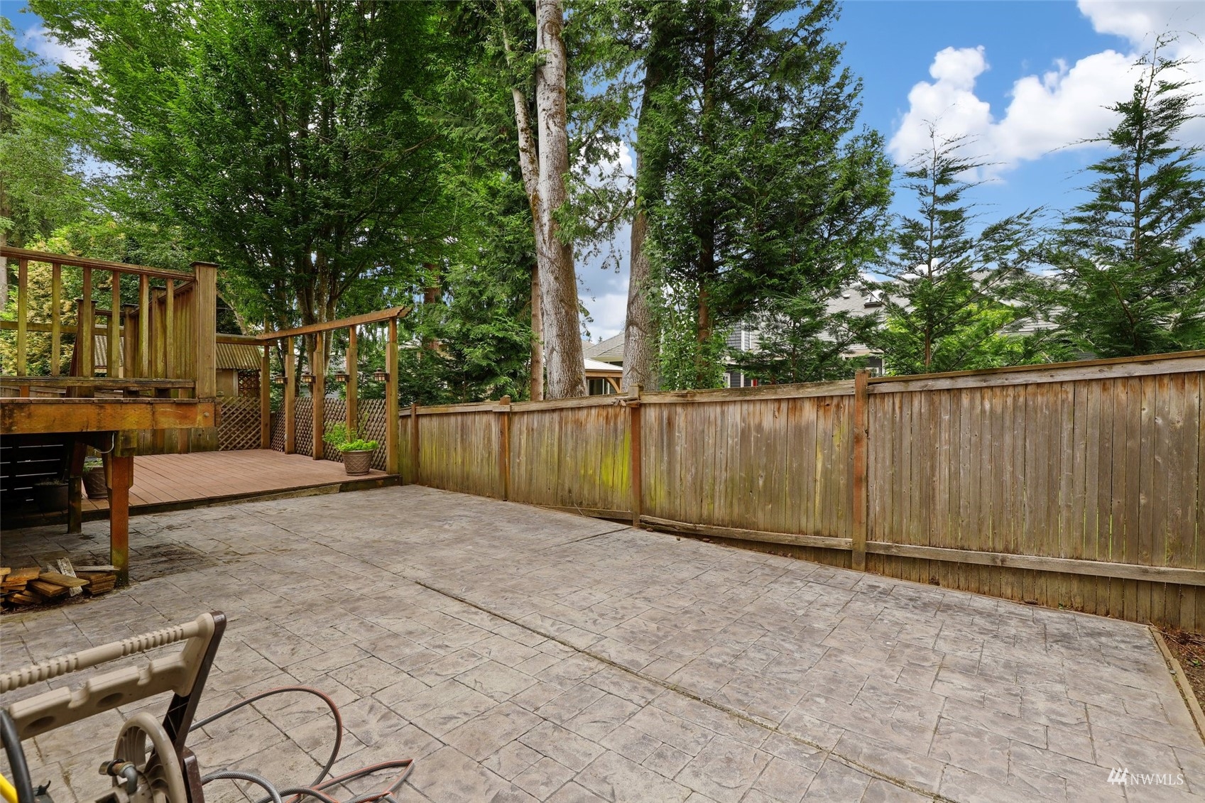 18808 1st Place West Bothell, WA 98012 - Photo 37 of 40 a view of backyard with wooden fence and a large tree