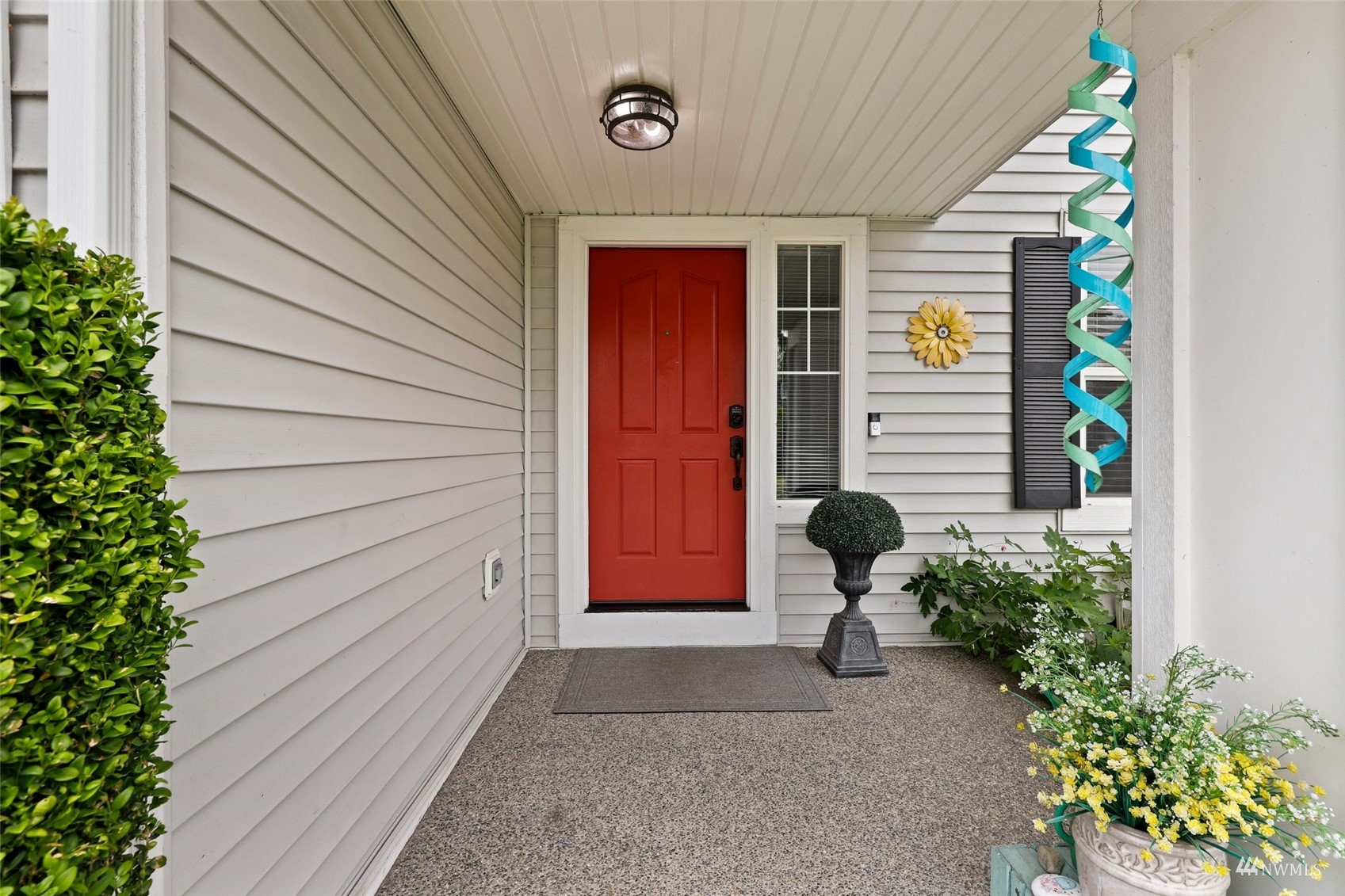 18808 1st Place West Bothell, WA 98012 - Photo 4 of 40 a potted plant sitting in front of a house