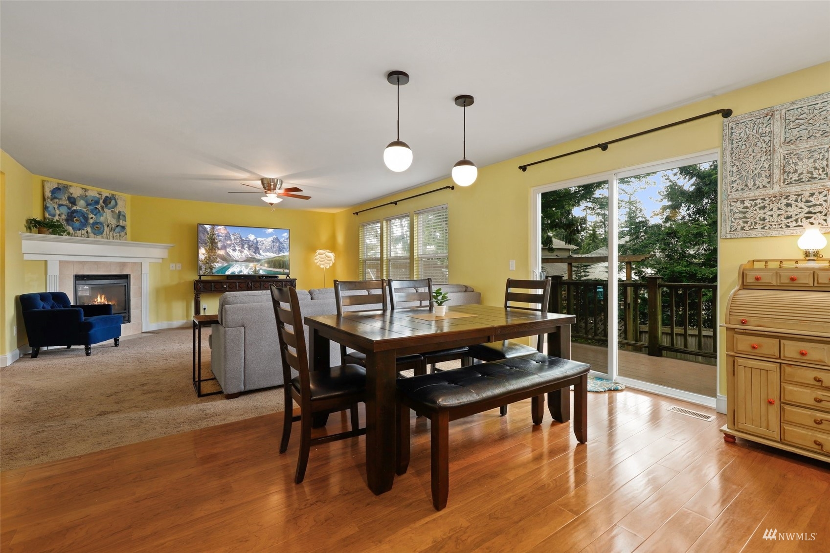 18808 1st Place West Bothell, WA 98012 - Photo 8 of 40 a view of a dining room with furniture window and wooden floor